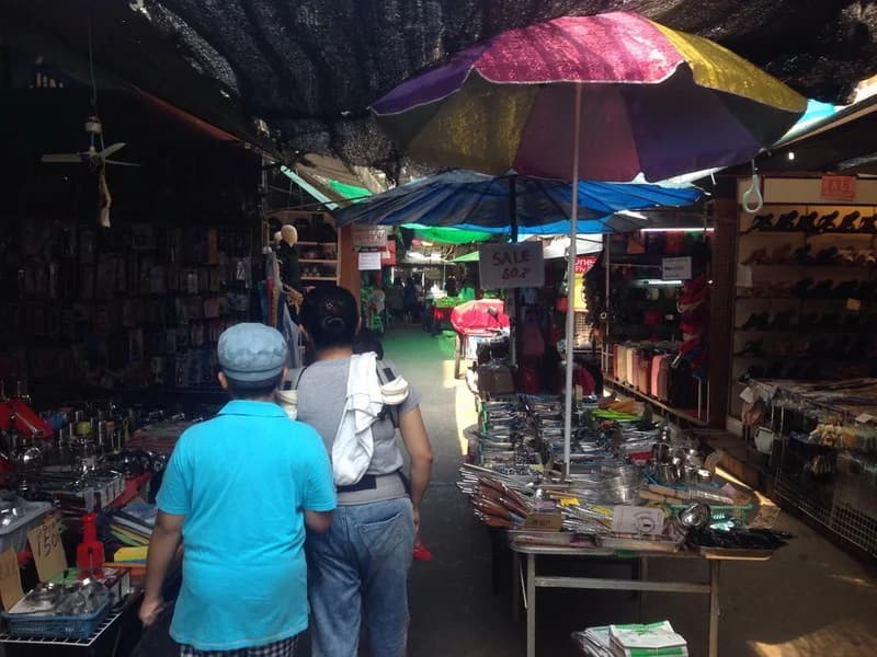 Colorful covered shopping aisle at Tachileik Market